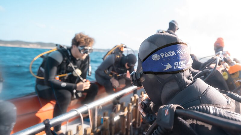 Diver wearing the PADI AWARE Dive Buddy Mask Strap