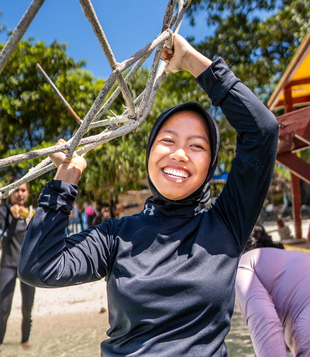 A Coral Catch Superwoman carrying a hex dome out to the Gili Matra Marine Reserve, Indonesia